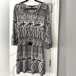 White House Black Market-  Above the knee, size 10, black and White pattern.